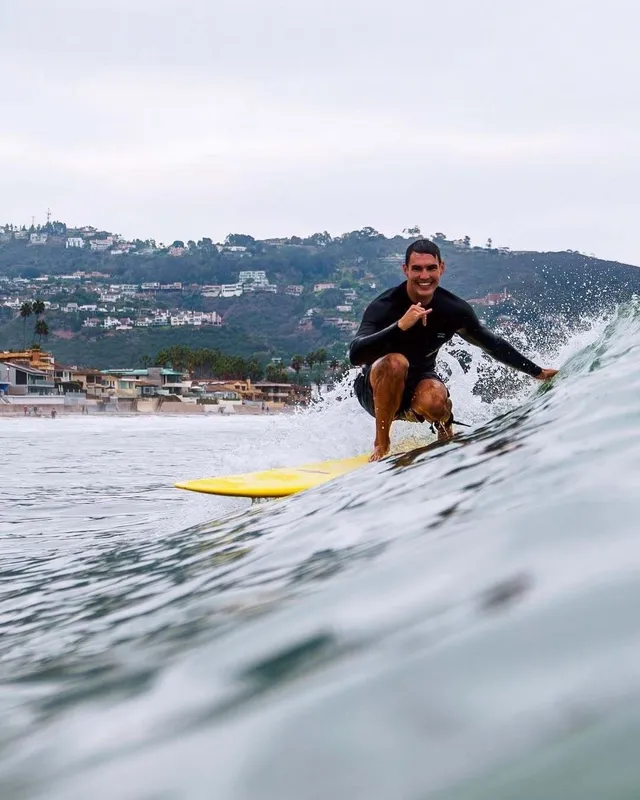 Joey surfing a wave off the San Diego coast